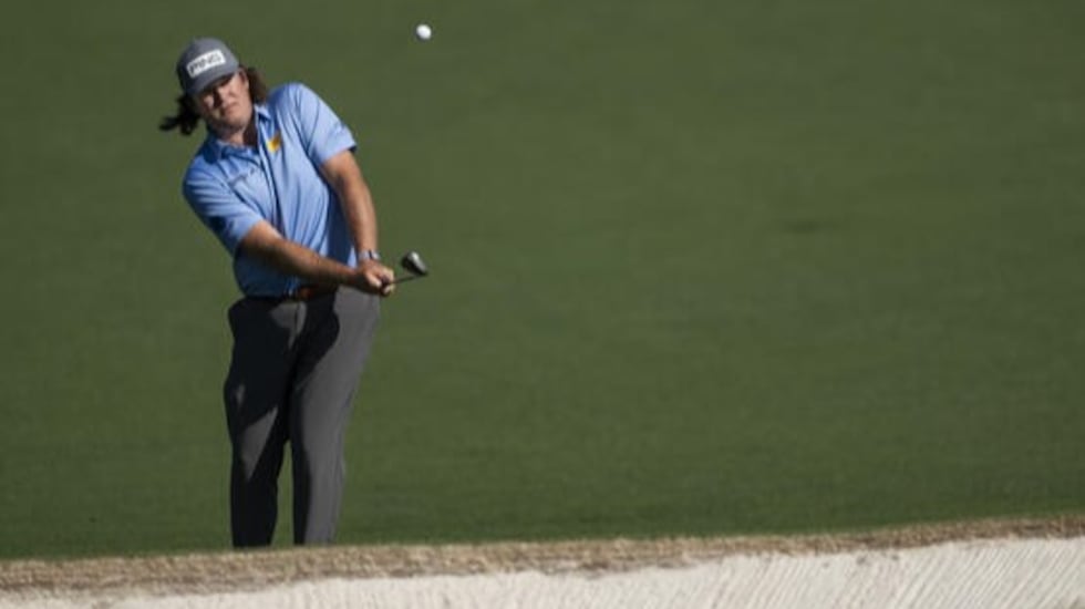 Amateur Neal Shipley of the United States chips to the No. 2 green during the final round of...