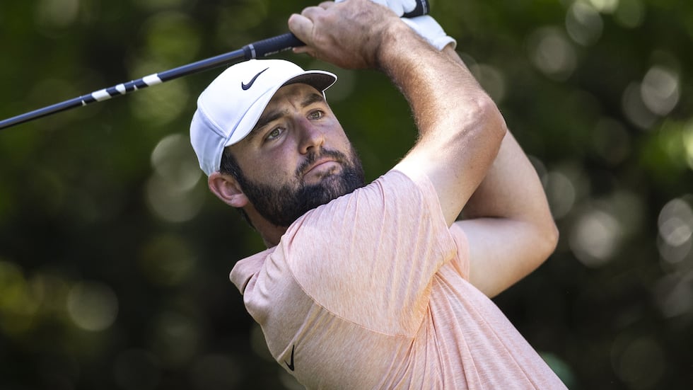 Masters champion Scottie Scheffler of the United States plays a stroke from the No. 7 tee...