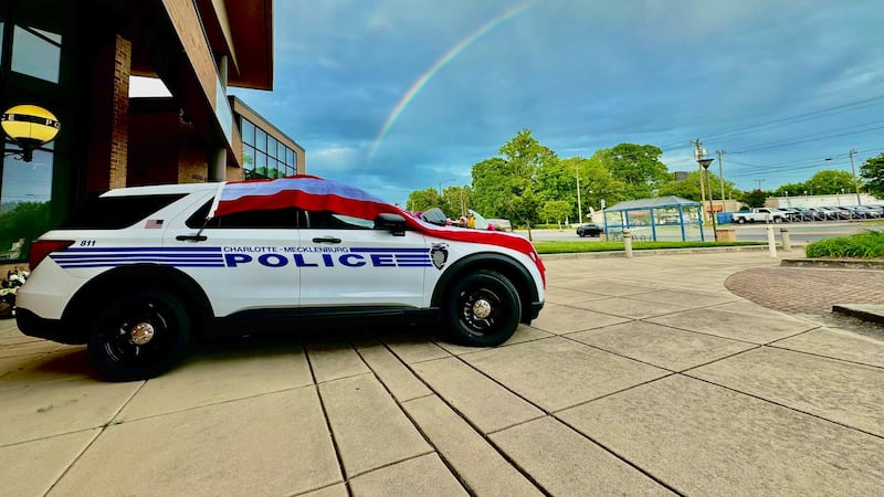 Rainbow over fallen CMPD officer's cruiser