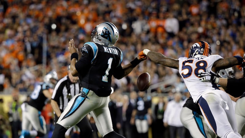 Denver Broncos Von Miller (58) strips the ball from Carolina Panthers Cam Newton (1) during...