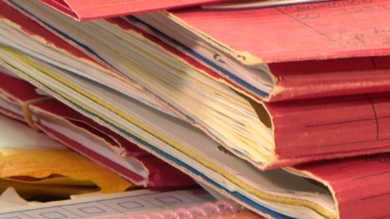 While the files on Jimmy Richardson's desk are stacked tall, Raymond Moody's file remains on top