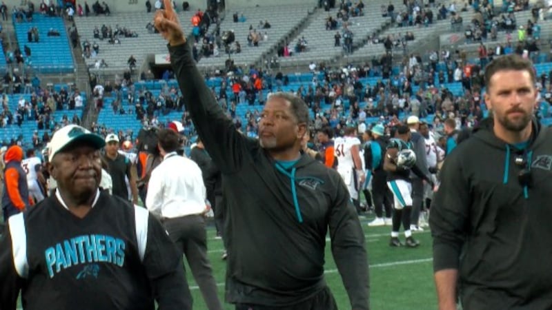 Carolina Panthers interim head coach Steve Wilks celebrates after his team beat the Denver...
