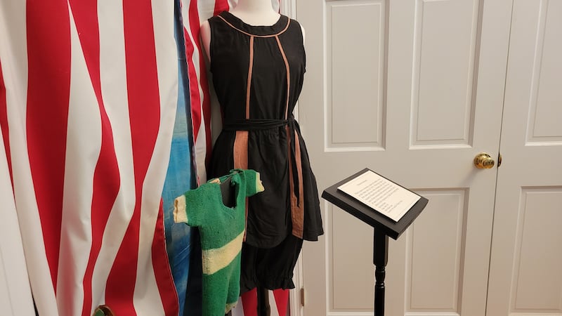 A hallway at the Marion County Museum features clothing from various historical periods.