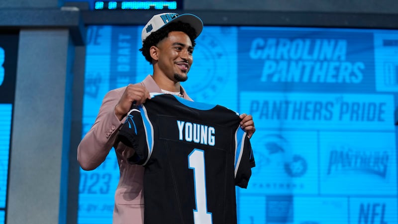 Alabama quarterback Bryce Young poses after being chosen by Carolina Panthers with the first...