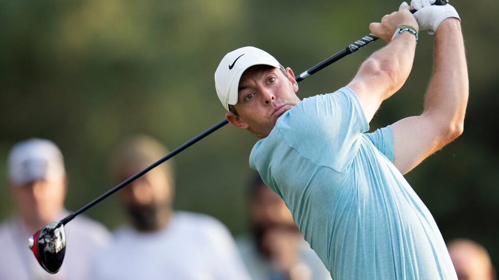 Rory McIlroy of Northern Ireland plays a stroke from the No. 18 tee during the first round of...